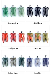 Detail view of tooth-shaped crystal pendants in aventurine obsidian and agate