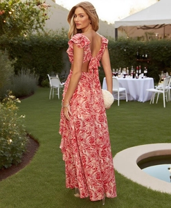 Detail of elegant red paisley print dress with backless tie-up design and ruffle sleeves
