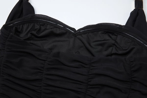 Detail view of the anti-slip silicone strip and ruched black mesh fabric on the dress