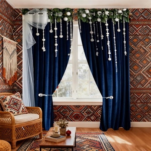 Detail of dark blue velvet Christmas curtain with pine needles and silver metal rings