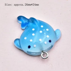 Macro detail of whale shark ocean charm with dimensions 26mm by 24mm on pink background