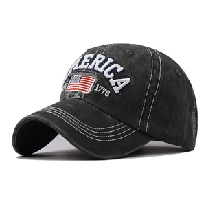 Close-up of embroidered American flag and America 1776 text on washed cotton baseball cap