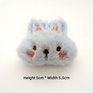Detail of 5cm x 5.5cm blue plush bunny craft accessory with pink embroidery details