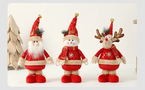 Detail of Christmas plush figurines including Santa, Snowman and Reindeer with knit textures