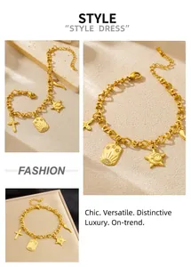 Detailed close-up of gold stainless steel bracelet with cross and star charms