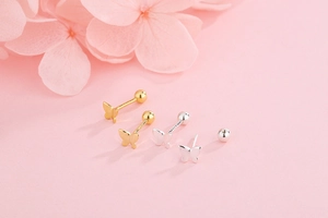 Detail of S925 sterling silver butterfly screw back studs in gold and silver finishes