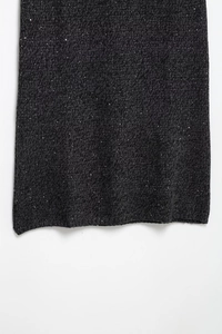 Close-up of dark grey tweed fabric with silver sequins and knit texture detail