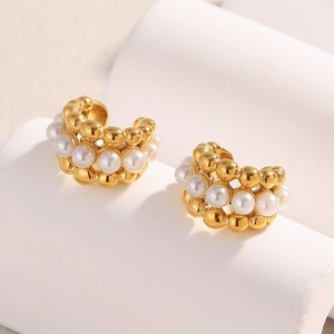 Close-up of elegant 18K gold plated geometric ear cuffs with white imitation pearls