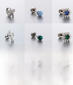 Detail set of six titanium steel stud earrings with opal and cubic zirconia designs