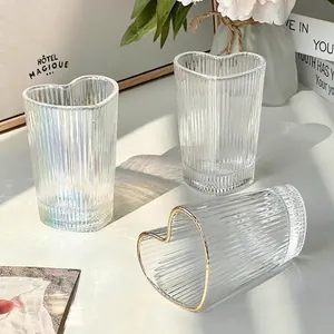 Creative heart-shaped glass mugs with vertical ribbed texture and gold rim design