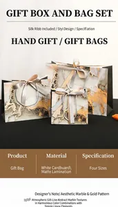 Close-up of gold leaf detailing on marble gift bags with elegant ribbon handles