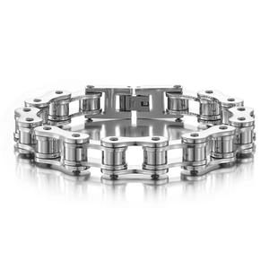 Macro shot of silver motorcycle chain bracelet showing engraved STAINLESS STEEL text