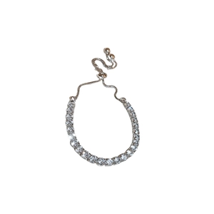 Adjustable silver tennis bracelet with round cubic zirconia and bolo slider clasp