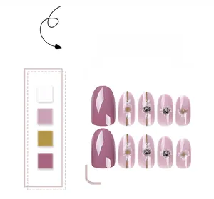 Detail of pink floral press-on nails with silver rhinestones and hand-painted patterns