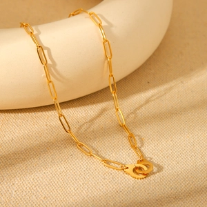 Golden stainless steel paperclip chain necklace with a small handcuff pendant design