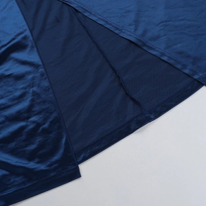 Detailed close-up showing the double-stitched hem and slit on the dark blue satin dress