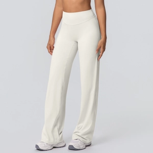 Detail of high waisted flared yoga pants featuring soft brushed fabric in creamy white color