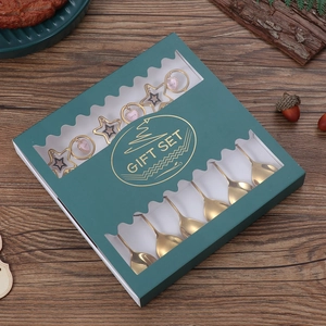 Golden 304 stainless steel Christmas spoon set with star charms in a premium green gift box