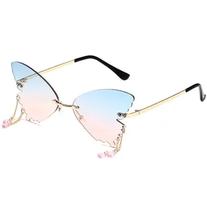 Frameless butterfly wing sunglasses with gradient lenses and hanging metal chains