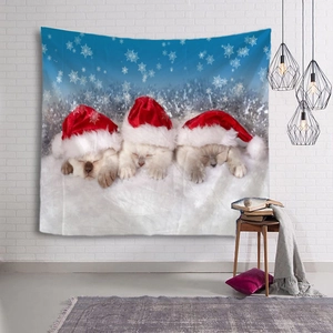 Detail of Christmas tapestry featuring three kittens in santa hats on a snowy night background