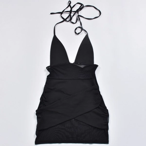 Detail of black halter mesh dress featuring sheer panels and pleated chest design