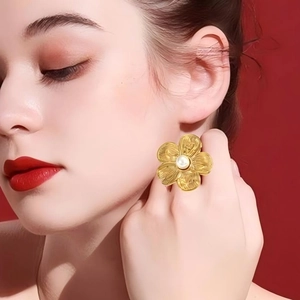 18k gold plated stainless steel vintage flower ring with pearl center on red background