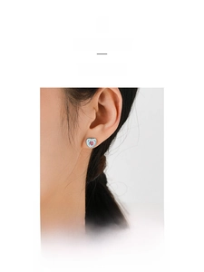 Detailed close-up of a heart-shaped S925 silver stud earring with blue enamel and pink zircon