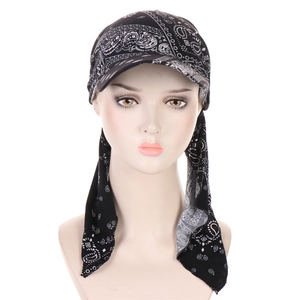 Detail of black paisley bandanna cap with visor and long ties for women