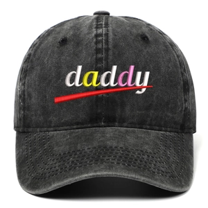 Detailed view of the multicolor daddy embroidery on a washed black cotton baseball cap