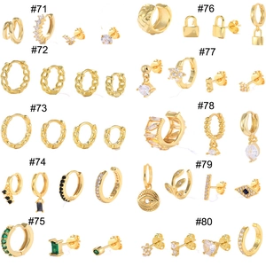 Detailed grid of gold-plated earrings with colorful zircon stones in various designs
