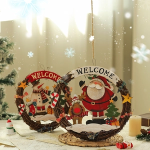 Christmas welcome door sign with wooden Santa and snowman on natural rattan wreath