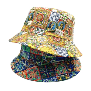 Detail of bohemian bucket hat with colorful sunflower prints and Sicilian style patterns