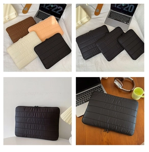 Quilted laptop sleeve collection in black, brown and cream with padded puffer texture