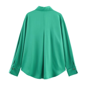 Green long sleeve satin shirt for women featuring a back pleat and curved hemline