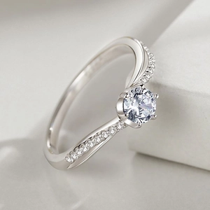 Elegant S925 sterling silver six-prong cubic zirconia ring with sparkling pavé twisted band