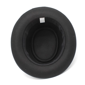 Internal view of black polyester fedora hat showing inner sweatband and care label details