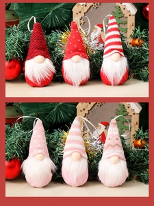 Detail of six knitted Christmas gnomes with long white beards and festive patterns