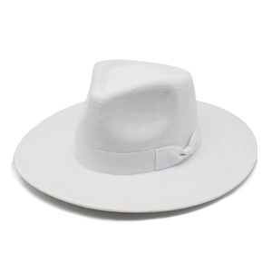 Detail of white wool wide brim fedora hat with a delicate matching ribbon and bow