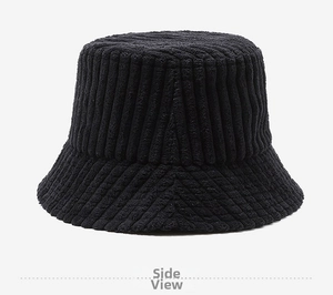 Detailed texture of black corduroy bucket hat with vertical ridges and vintage style