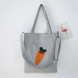 Cute canvas tote bag in light grey featuring a 3D orange carrot pattern with long strap