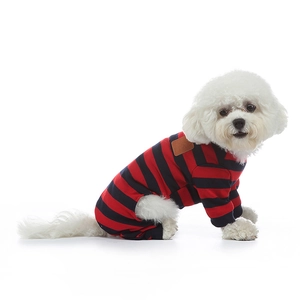 Detail of red and blue striped cotton pet pajamas with a brown leather patch on dog