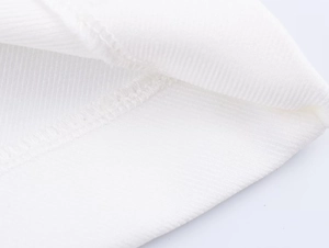 Macro detail of high-quality white linen blend fabric with precise stitching and textures