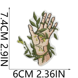 Macro shot of hand and botanical embroidery patch showing detailed size dimensions