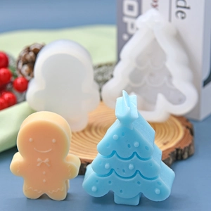 Christmas tree and gingerbread man silicone mold with finished wax melts on wood base