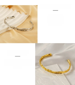 Detail showing irregular hammered texture on 18K gold and silver stainless steel bangles