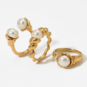 Three-piece gold plated stainless steel ring set with elegant white pearl accents