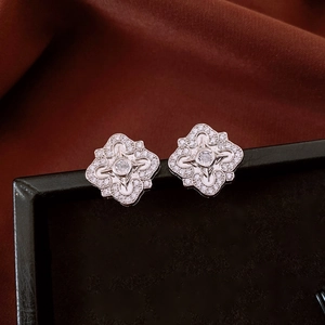 Macro shot of vintage silver rhodium-plated flower earrings with shimmering cubic zirconia