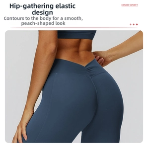 Detail view of high-waisted yoga flare pants with V-shaped back cross and scrunch butt design