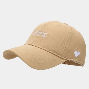 Detail of khaki cotton baseball cap featuring white heart and text embroidery