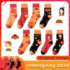 Colorful Thanksgiving crew socks with turkey and pilgrim patterns in red, orange and black